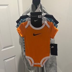 Nike Bright Orange Baby Bodysuit